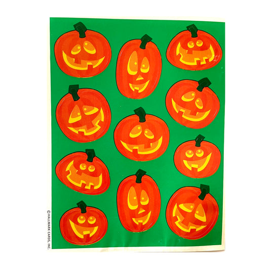 HALLMARK: Carved Pumpkins Stickers on green background.